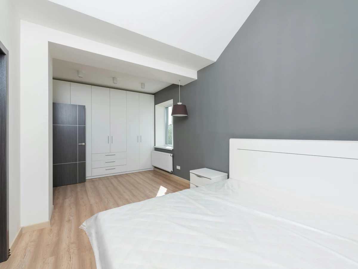 bedroom-painting-bedroom-grey-accent-altrincham-decorators Bedroom with grey accent feature wall painted by Altrincham Decorators