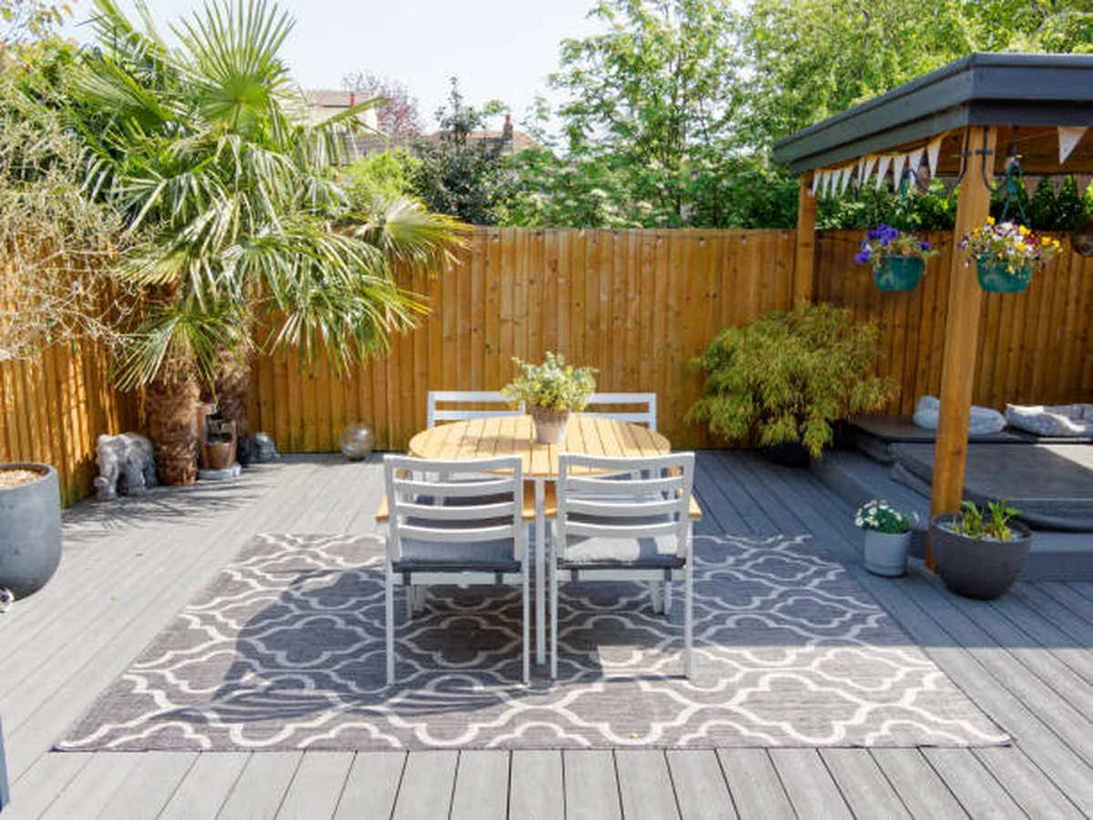 Garden deck with dining area treated by Altrincham Decorators