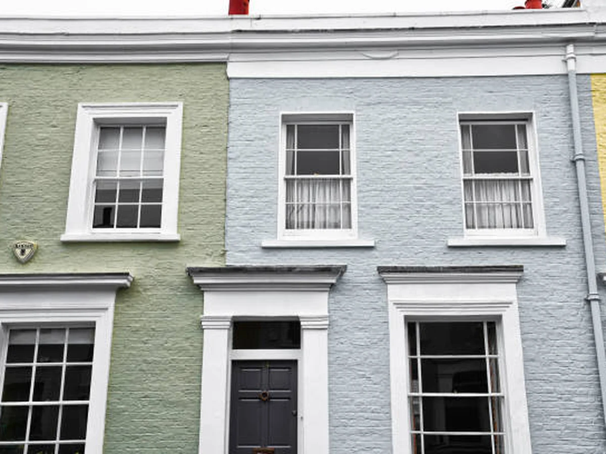 Exterior painting of brick terraced houses in Altrincham by experienced painters