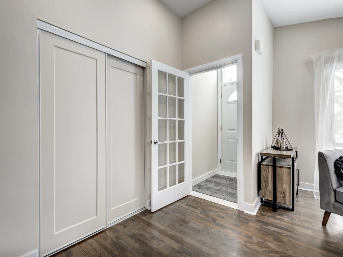Interior hallway painting in Urmston by Altrincham Decorators, bright white entryway finish