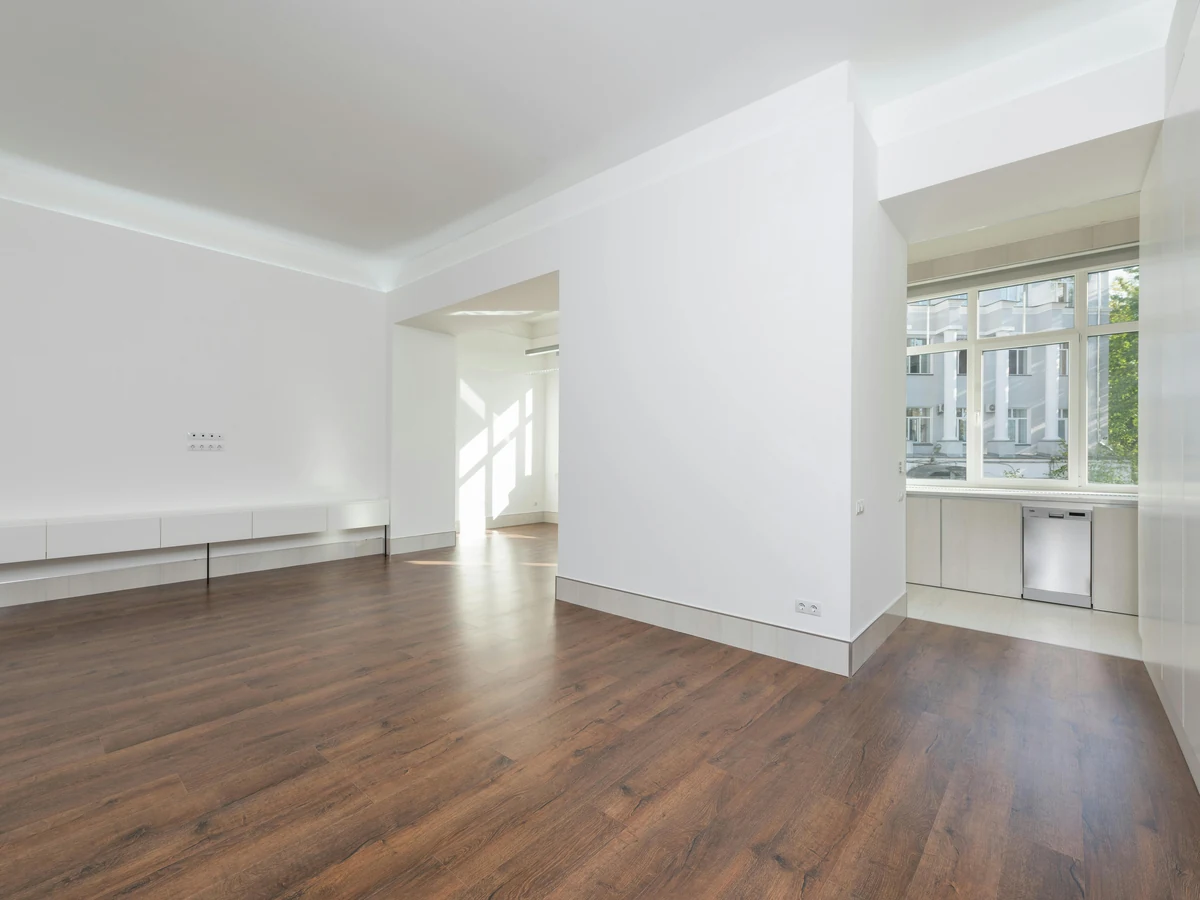 Empty white living room interior painting in Altrincham, clean finish on fresh plasterboard