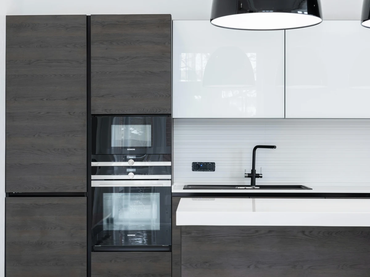 Dark grey kitchen cabinets with wood accents professionally painted