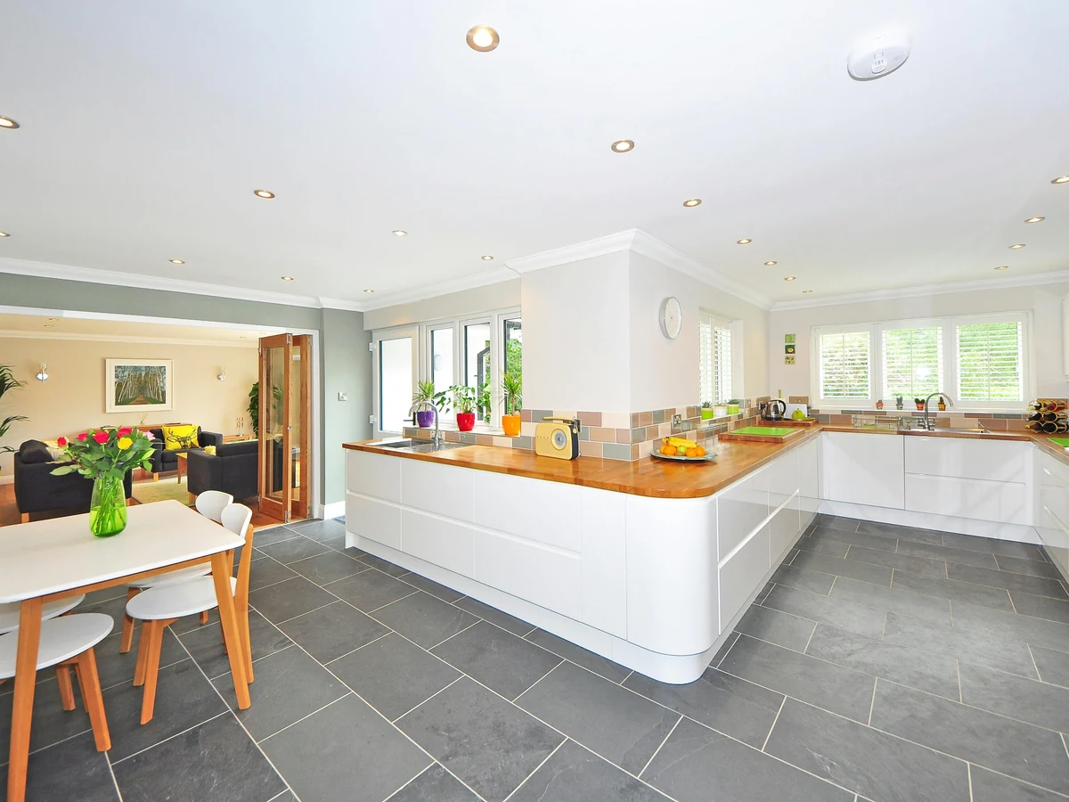 Large open-plan kitchen painted by Altrincham Decorators